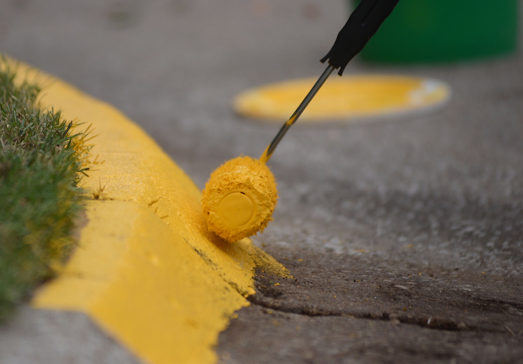 Marquell Robinson repaints the curb